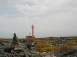 27851 Pillar of rocks and lighthouse Faro de Toston.jpg